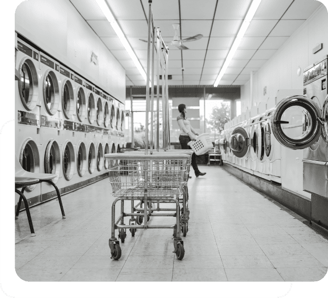 A black and white photo of a laundry room.